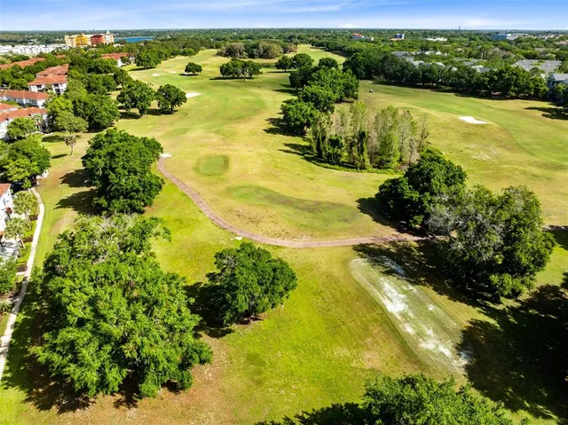 an aerial view of multiple houses with yard