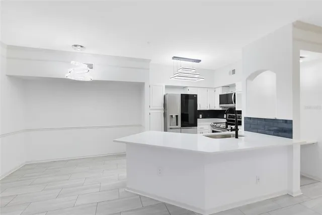 a view of living room with furniture and flat screen tv