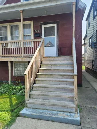 a view of a brick building with many windows