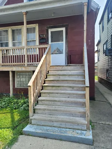 a view of a brick building with many windows