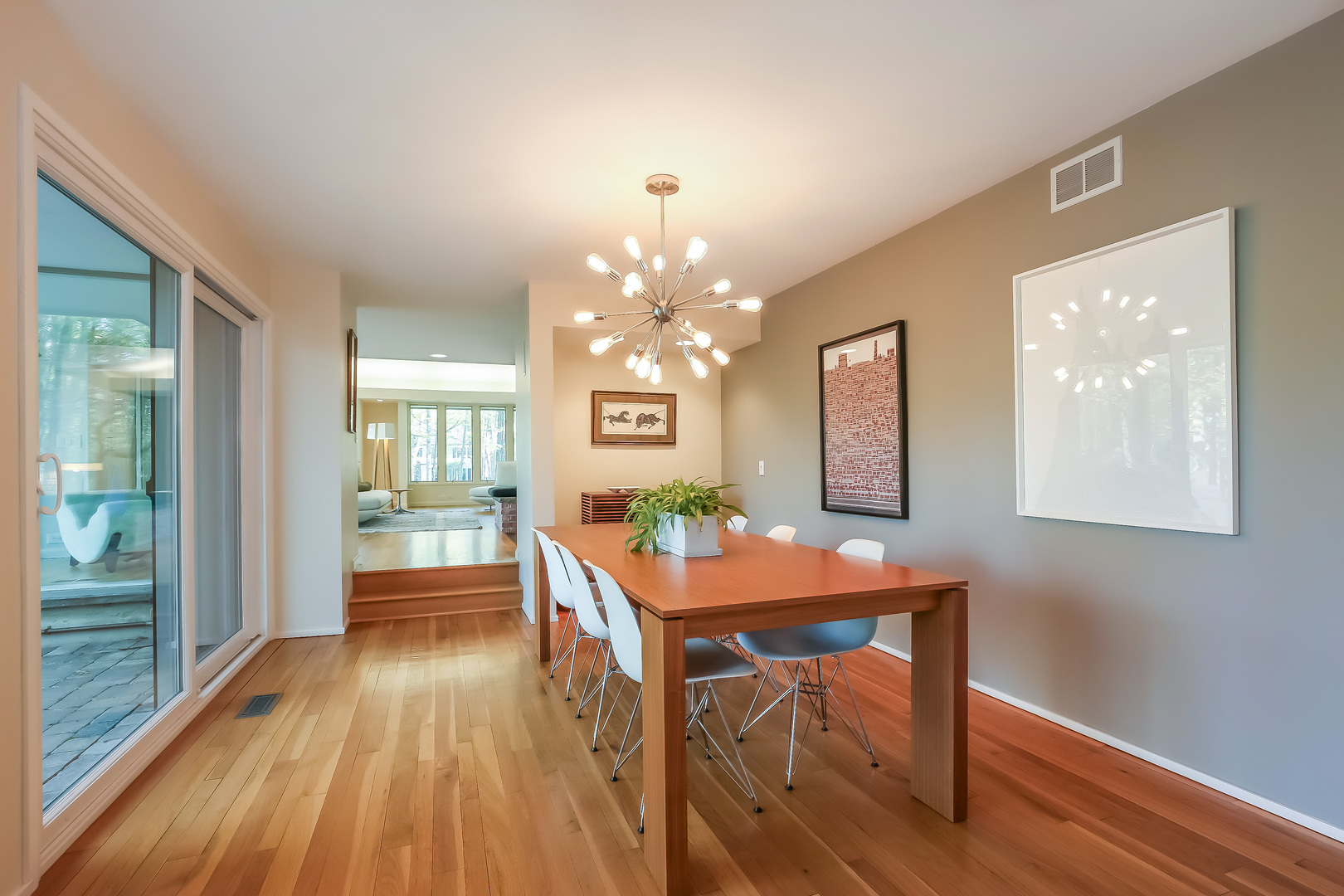 506 Forest Cove Road Lake Bluff, IL 60044 - Photo 11 of 53 a dining room with furniture a chandelier and wooden floor