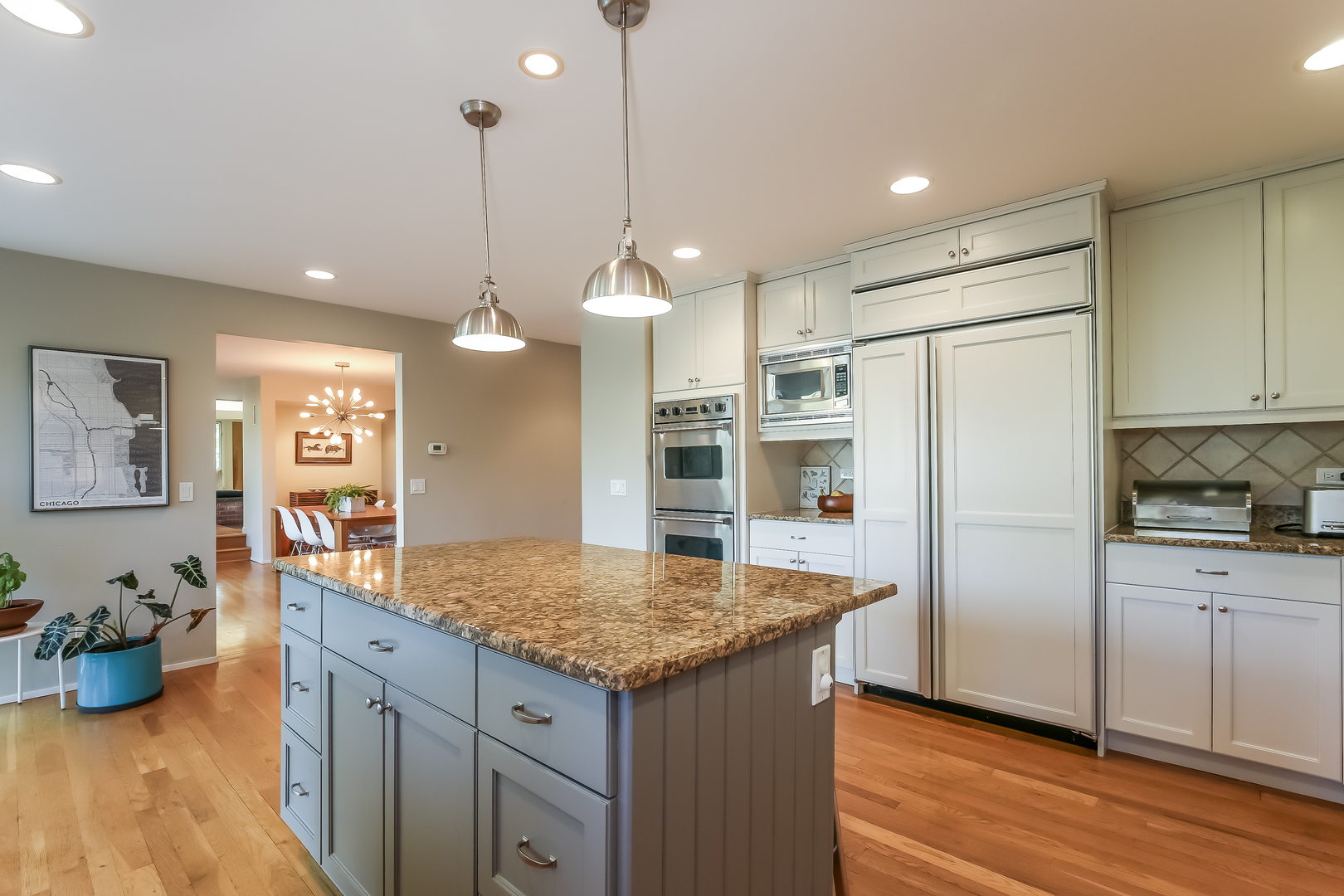 506 Forest Cove Road Lake Bluff, IL 60044 - Photo 12 of 53 a kitchen with stainless steel appliances granite countertop a refrigerator a sink dishwasher and a wooden cabinets with wooden floor