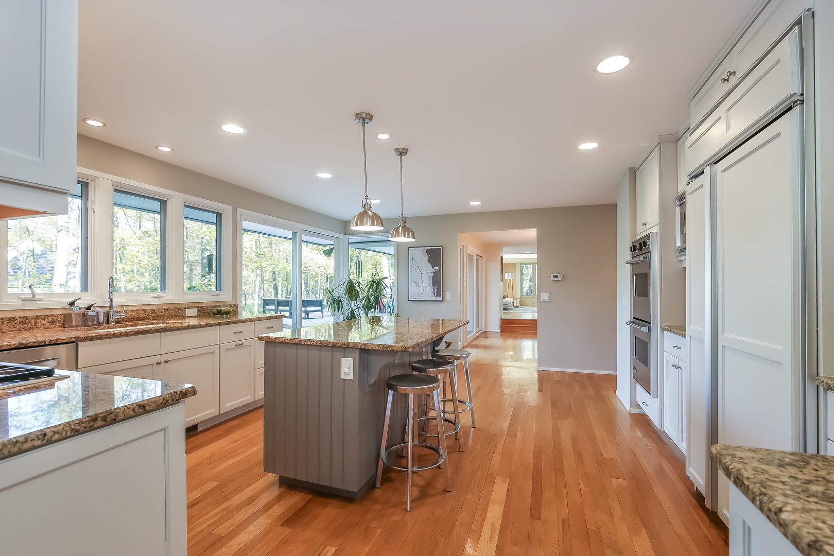 506 Forest Cove Road Lake Bluff, IL 60044 - Photo 15 of 53 a kitchen with stainless steel appliances granite countertop wooden floors sink and window