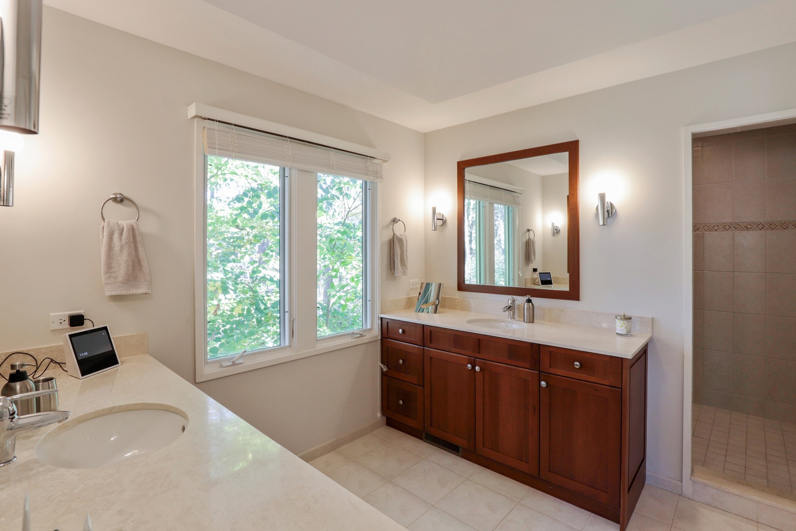 506 Forest Cove Road Lake Bluff, IL 60044 - Photo 28 of 53 a bathroom with a double vanity sink and mirror with window