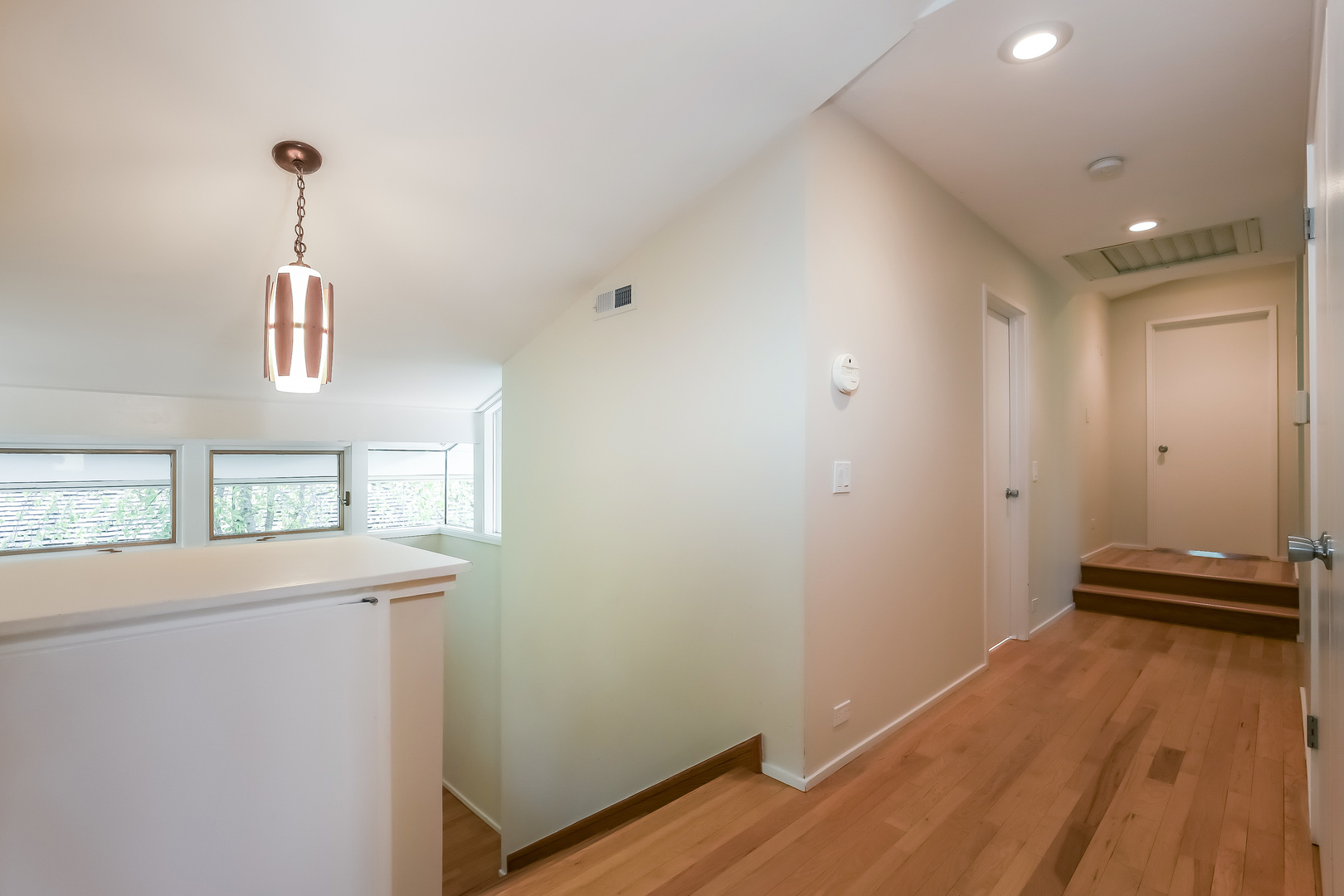 506 Forest Cove Road Lake Bluff, IL 60044 - Photo 34 of 53 a view of a room with wooden floor and a ceiling fan