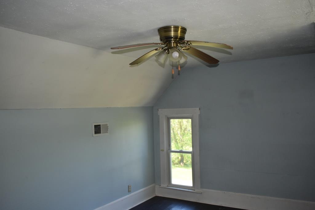14436 Indian Springs Road Buffalo Valley, TN 38548 - Photo 5 of 24 an empty room with windows and fan