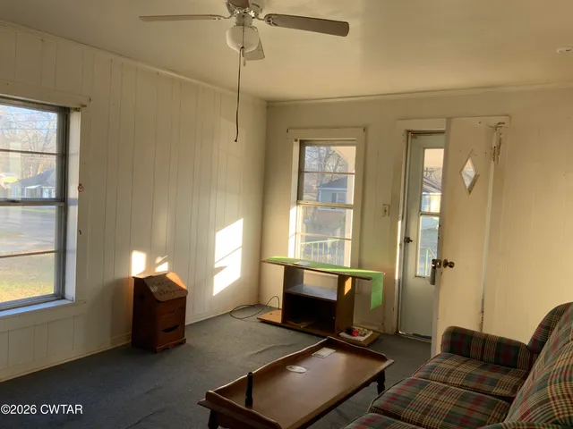 a living room with furniture and a window