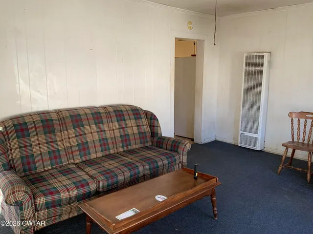 a bedroom with bed and a window