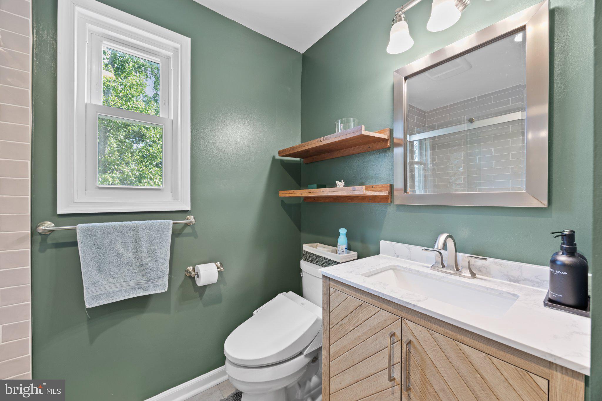 6705 New Hope Drive Springfield, VA 22151 - Photo 39 of 67 Chic bathroom with modern accents.
