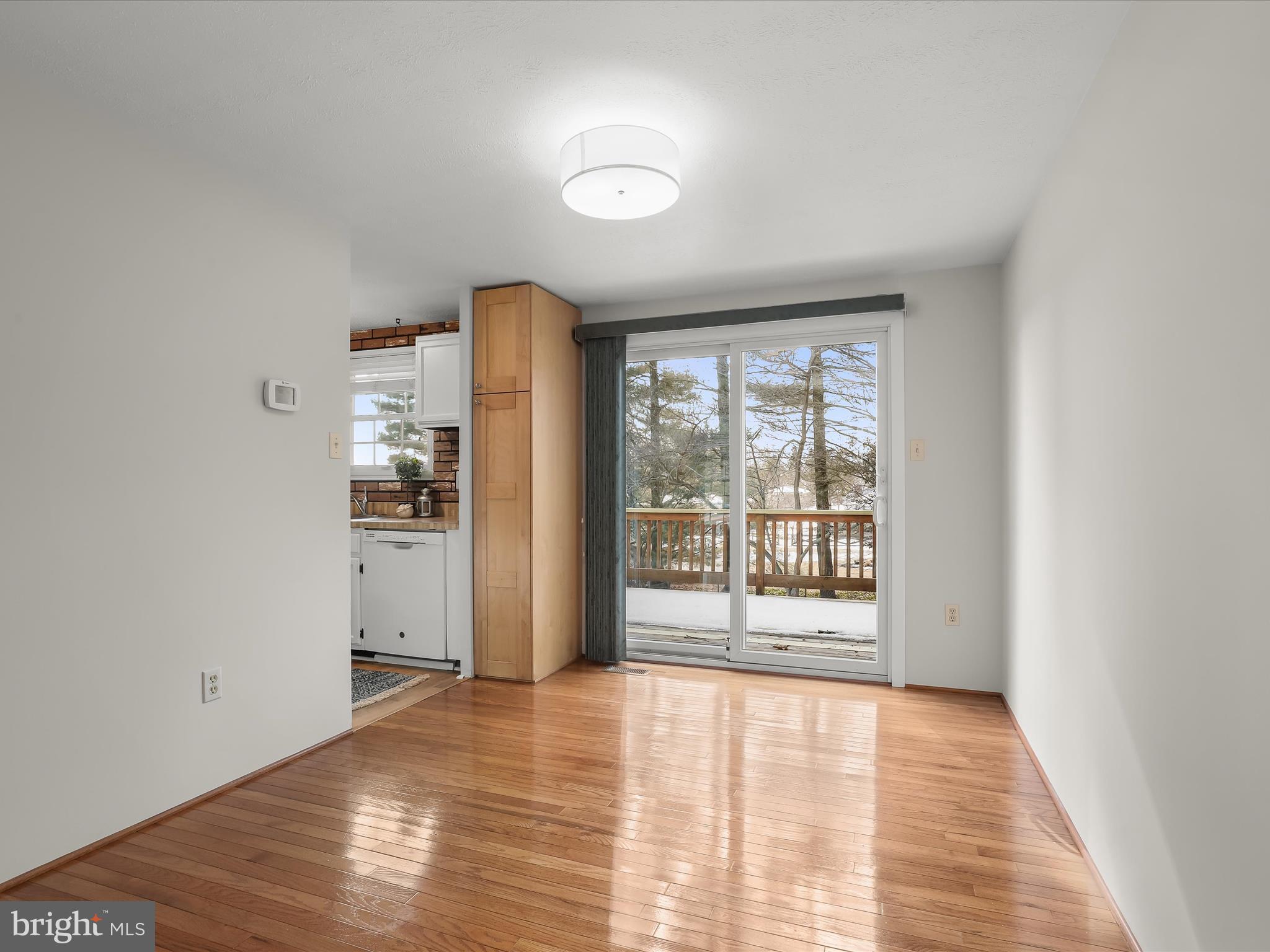 7971 Quail Court Glen Burnie, MD 21061 - Photo 20 of 52 a view of an empty room with wooden floor and a window