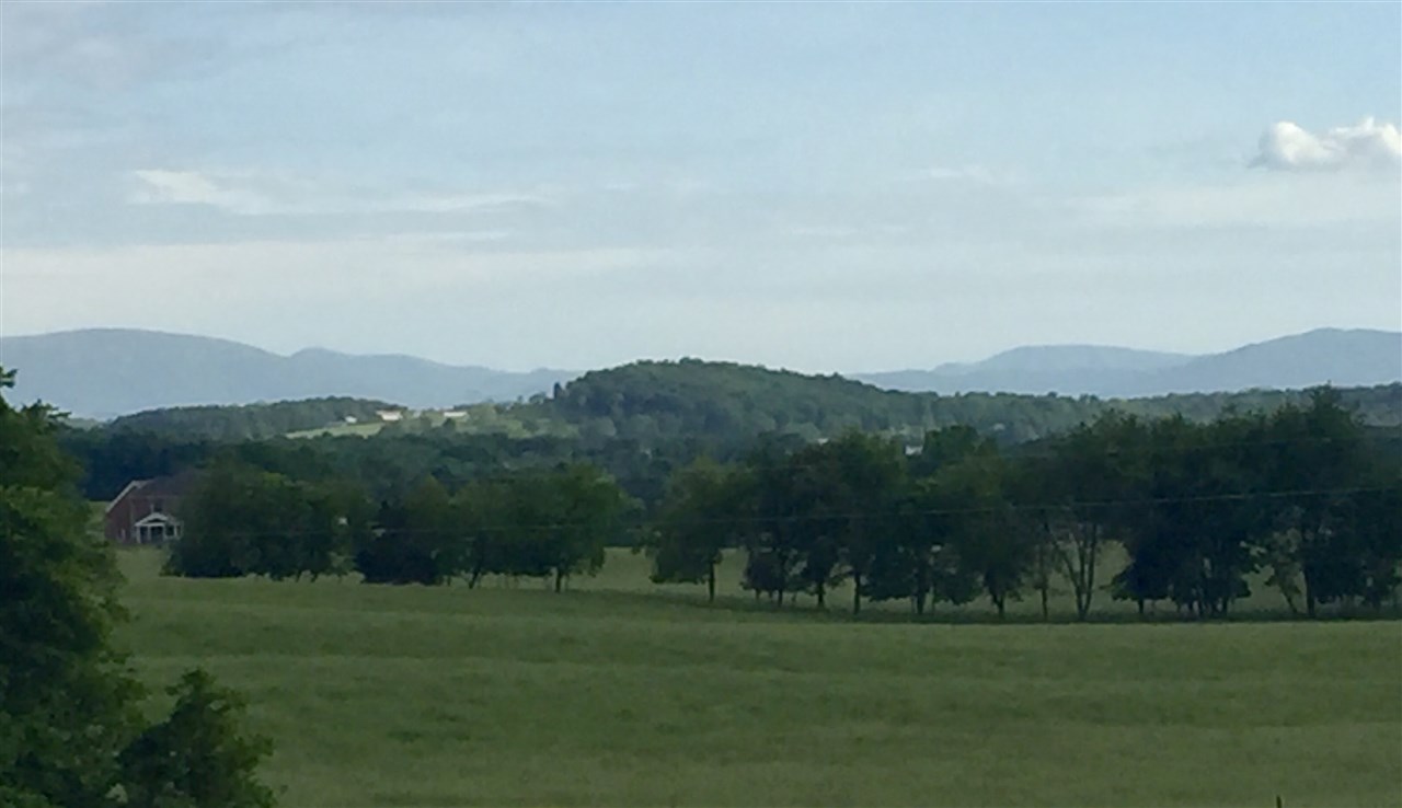 Tbd Round Hill Road New Hope, VA 24431 - Photo 4 of 6 a view of a grassy field with mountain
