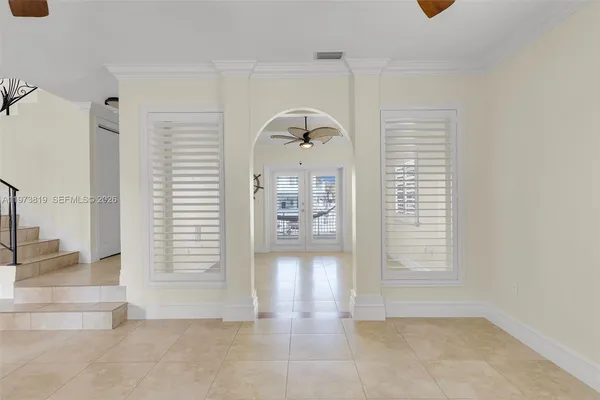 a view of a living room and balcony