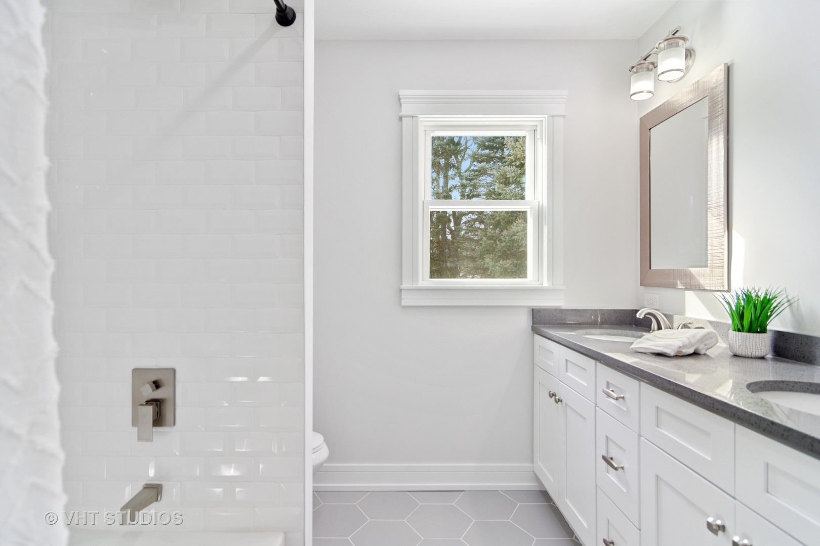 404 Cumnock Road Inverness, IL 60067 - Photo 21 of 34 a bathroom with a granite countertop sink a mirror and a shower