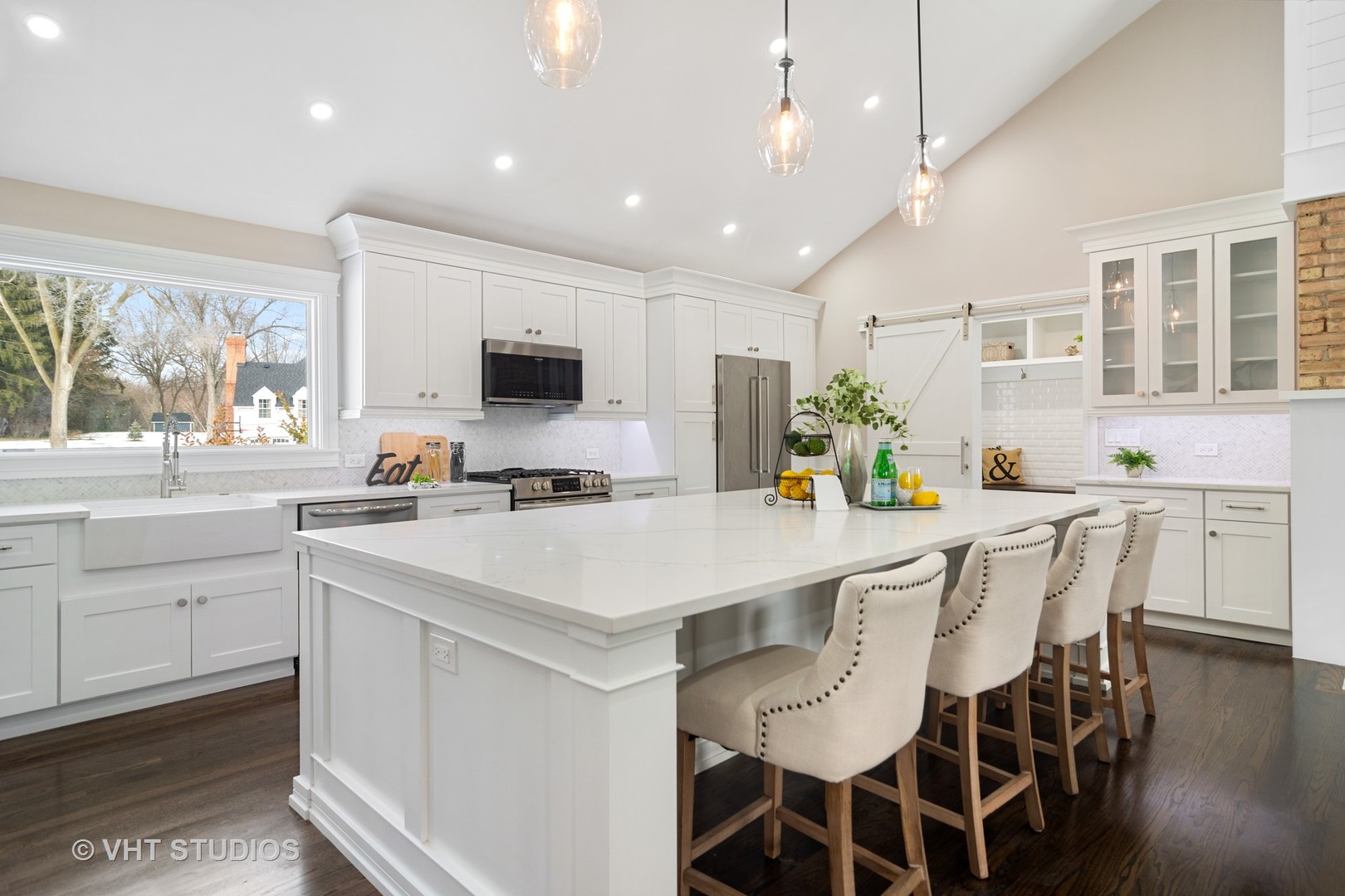 404 Cumnock Road Inverness, IL 60067 - Photo 7 of 34 a kitchen with a dining table chairs and white cabinets