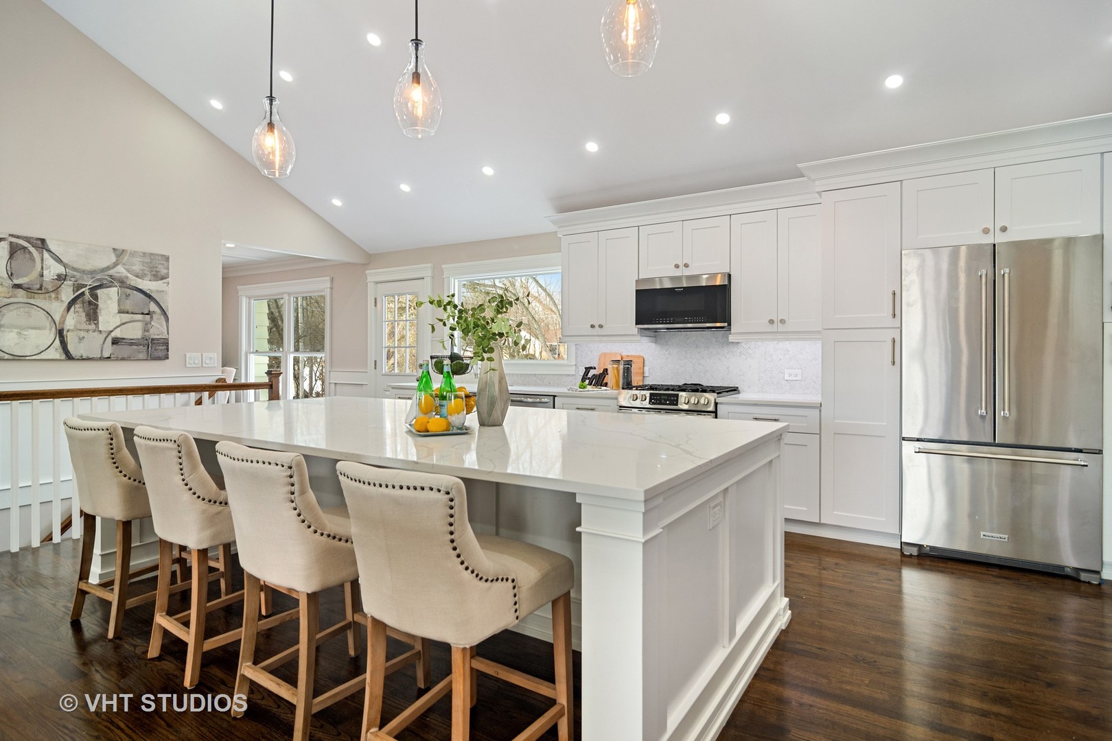 404 Cumnock Road Inverness, IL 60067 - Photo 9 of 34 a kitchen with a dining table chairs refrigerator and microwave