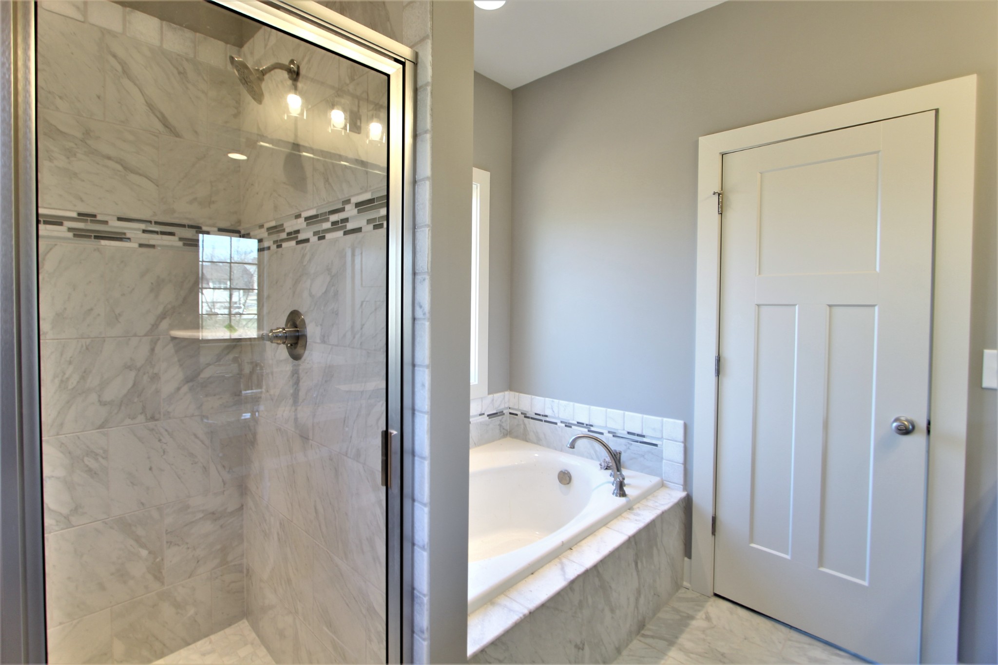 262 Ridgewater Way, Unit 83 Mount Juliet, TN 37122 - Photo 14 of 21 a bathroom with a bathtub and shower