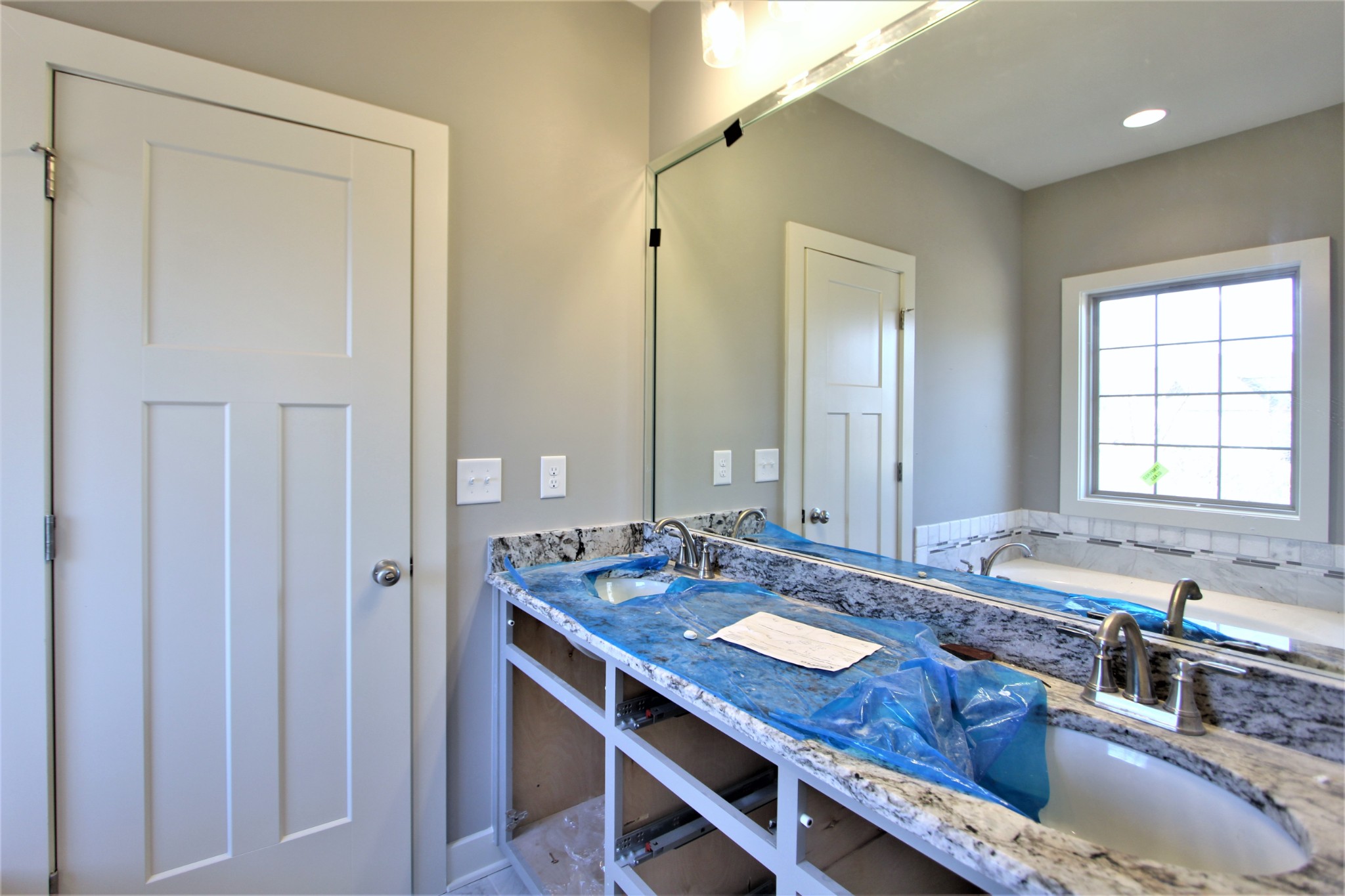 262 Ridgewater Way, Unit 83 Mount Juliet, TN 37122 - Photo 15 of 21 a bathroom with a granite countertop sink a mirror and a bathtub