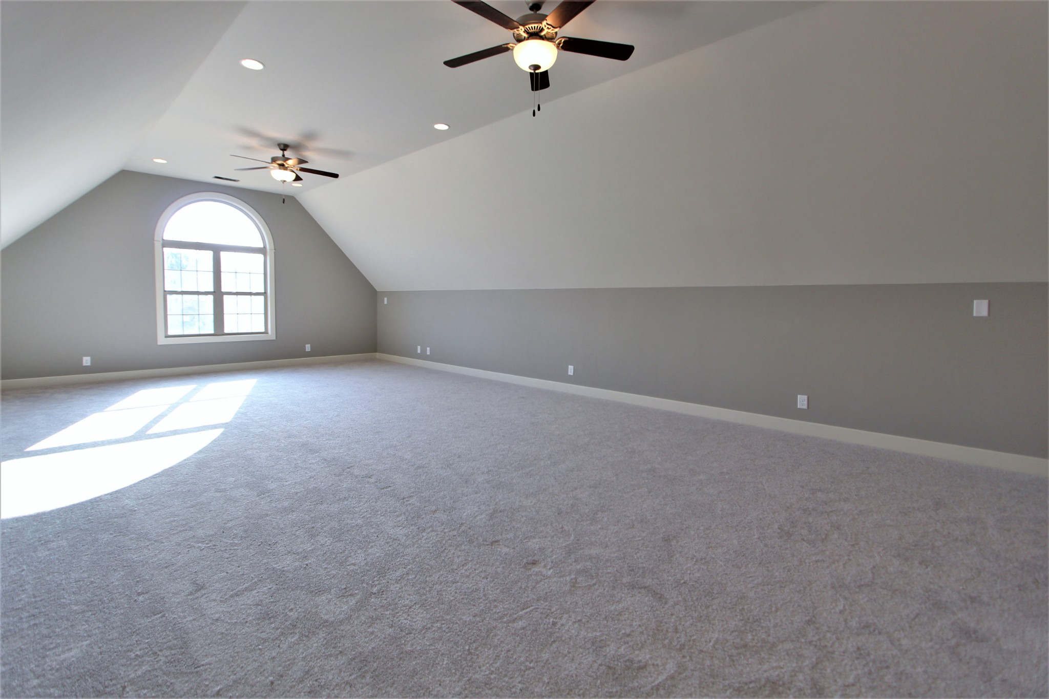 262 Ridgewater Way, Unit 83 Mount Juliet, TN 37122 - Photo 18 of 21 en empty room with windows and ceiling fan