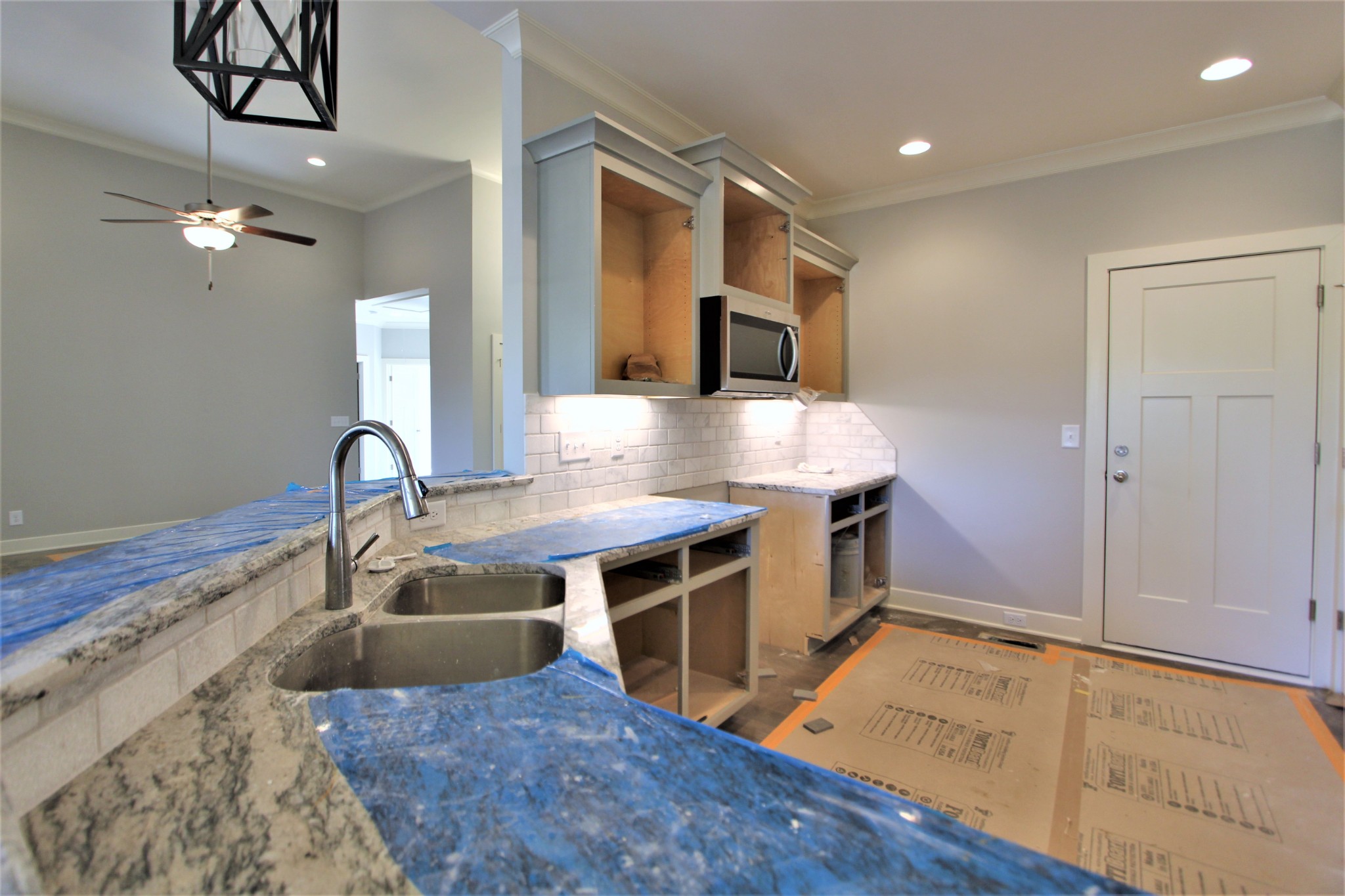 262 Ridgewater Way, Unit 83 Mount Juliet, TN 37122 - Photo 10 of 21 a view of kitchen with kitchen island a sink wooden floor and a stove