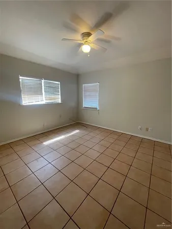 a view of an empty room and a window