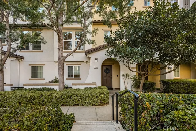 front view of a house with a garden