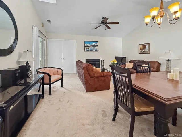 a view of a livingroom with furniture and a flat screen tv