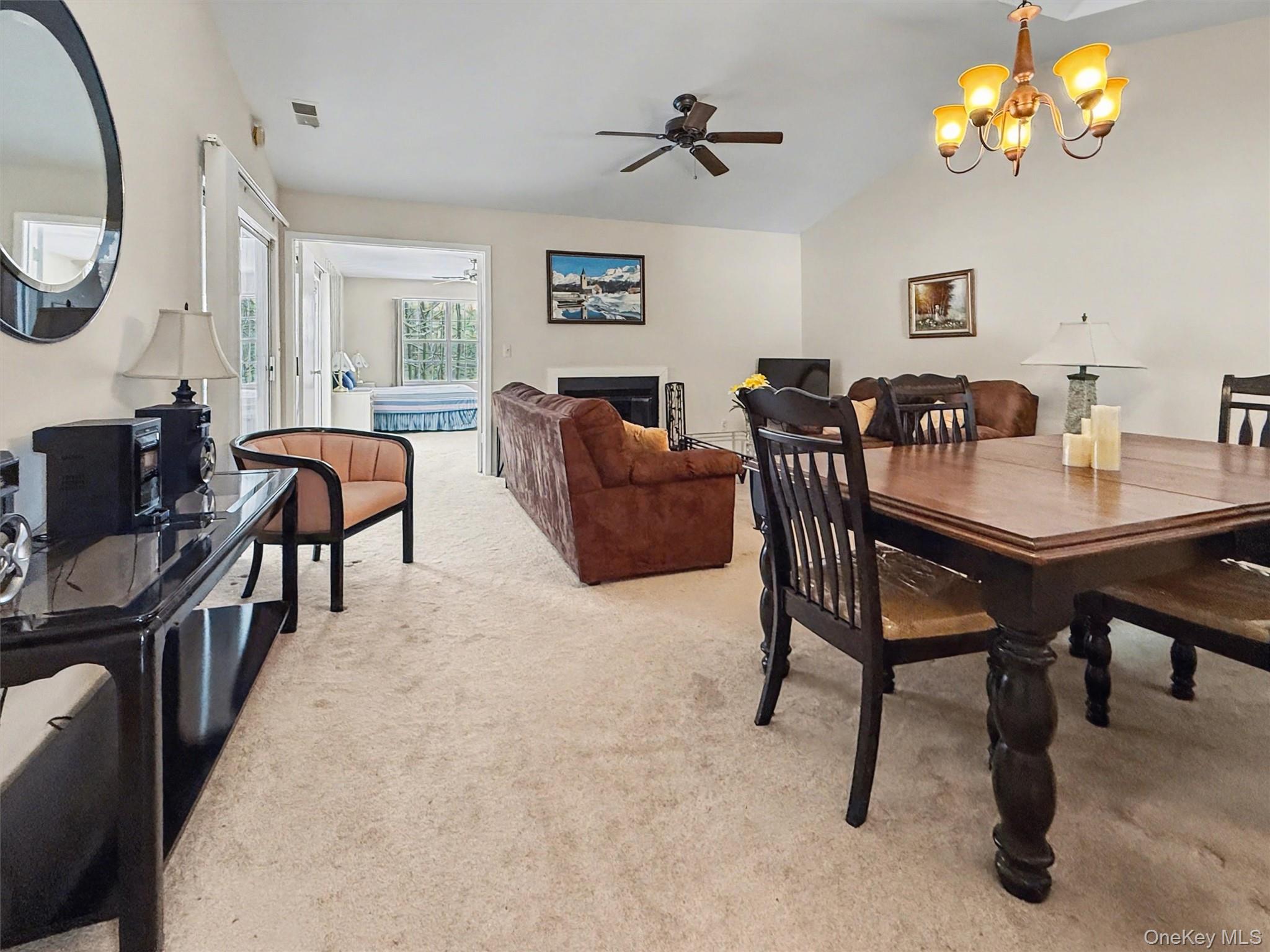51 Hidden Ridge Drive Monticello, NY 12701 - Photo 12 of 31 Living room opening through double doors to the spacious primary bedroom suite.