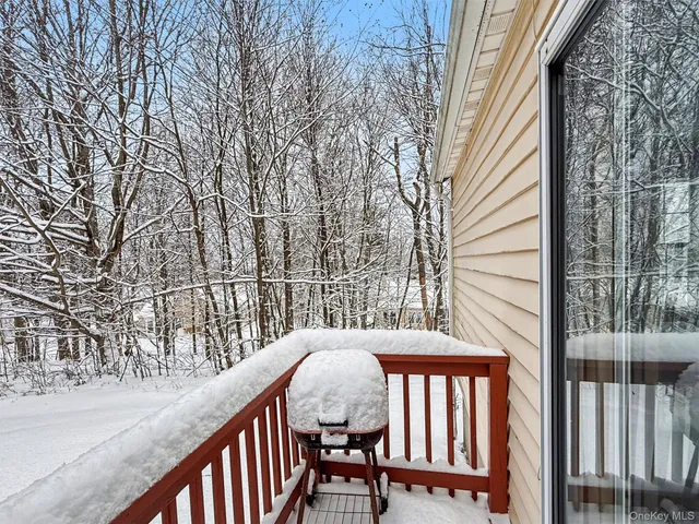 a view of a balcony with furniture
