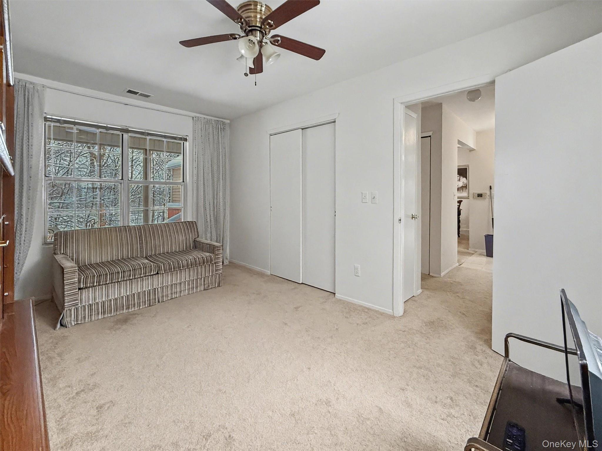 51 Hidden Ridge Drive Monticello, NY 12701 - Photo 22 of 31 Second bedroom with bathroom access just around the corner and a window overlooking the screened-in porch.