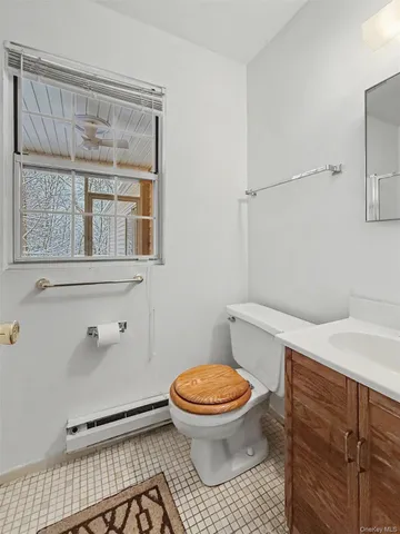 a bathroom with a toilet a sink and a shower