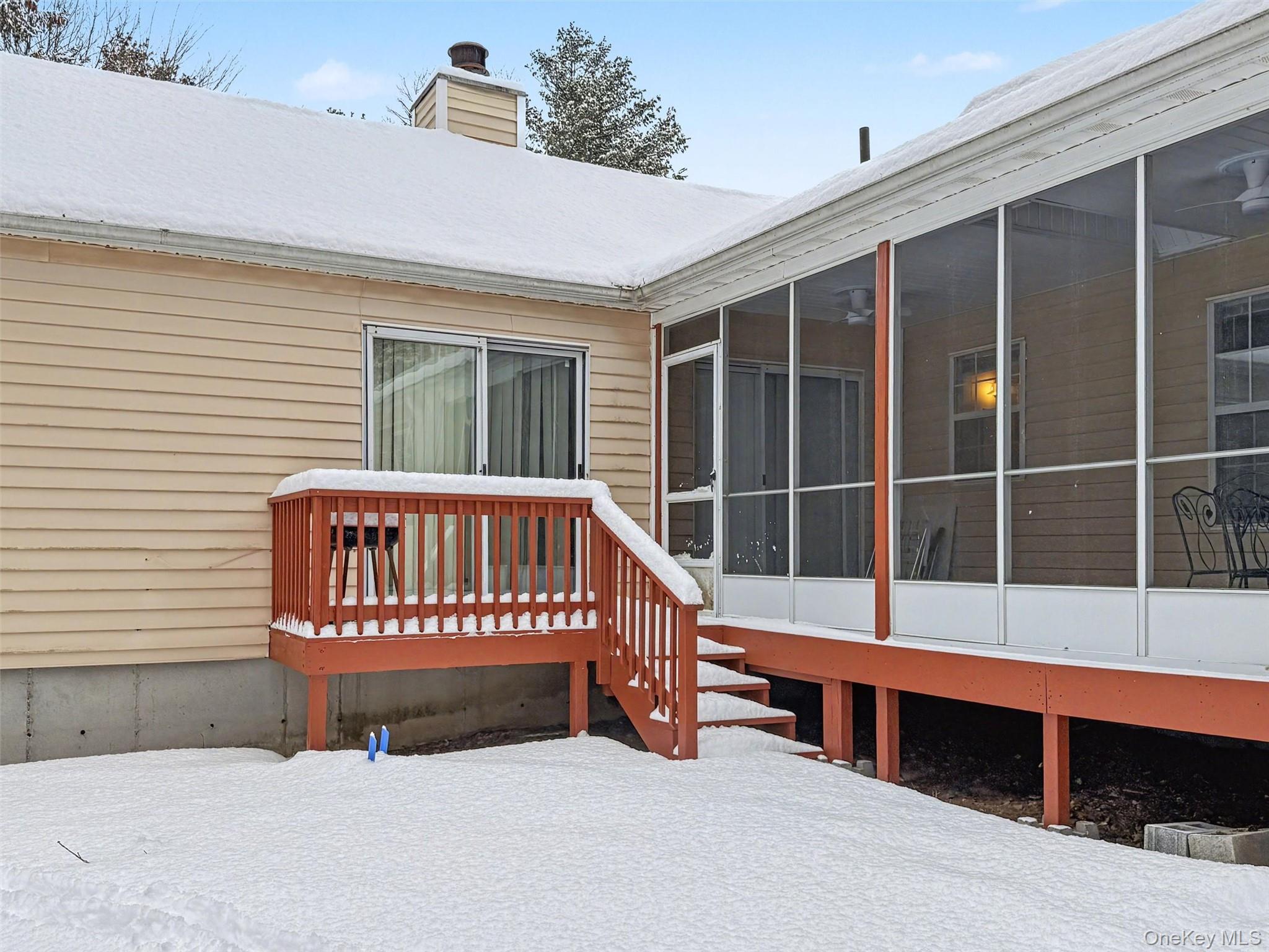 51 Hidden Ridge Drive Monticello, NY 12701 - Photo 28 of 31 Rear of home with entrances to the primary bedroom and screened in porch.