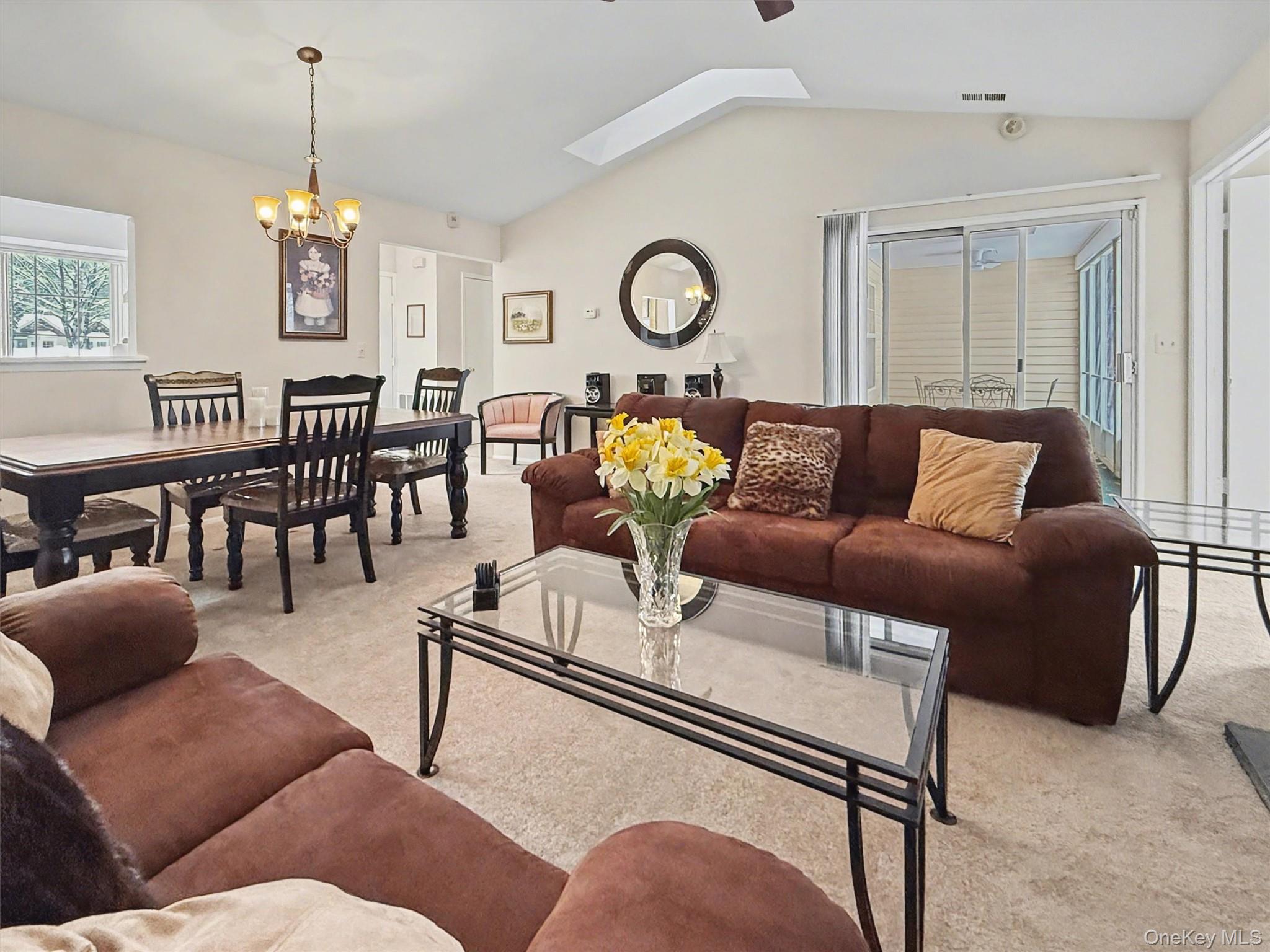 51 Hidden Ridge Drive Monticello, NY 12701 - Photo 8 of 31 Living room with seamless access to the screened-in porch.