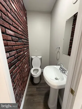 a bathroom with a toilet and a sink