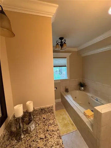 a bathroom with a tub and a sink