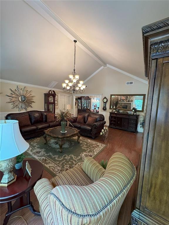 334 Eagle Circle Dillard, GA 30537 - Photo 12 of 29 a living room with furniture a chandelier and a rug