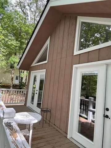 a view of a balcony with furniture
