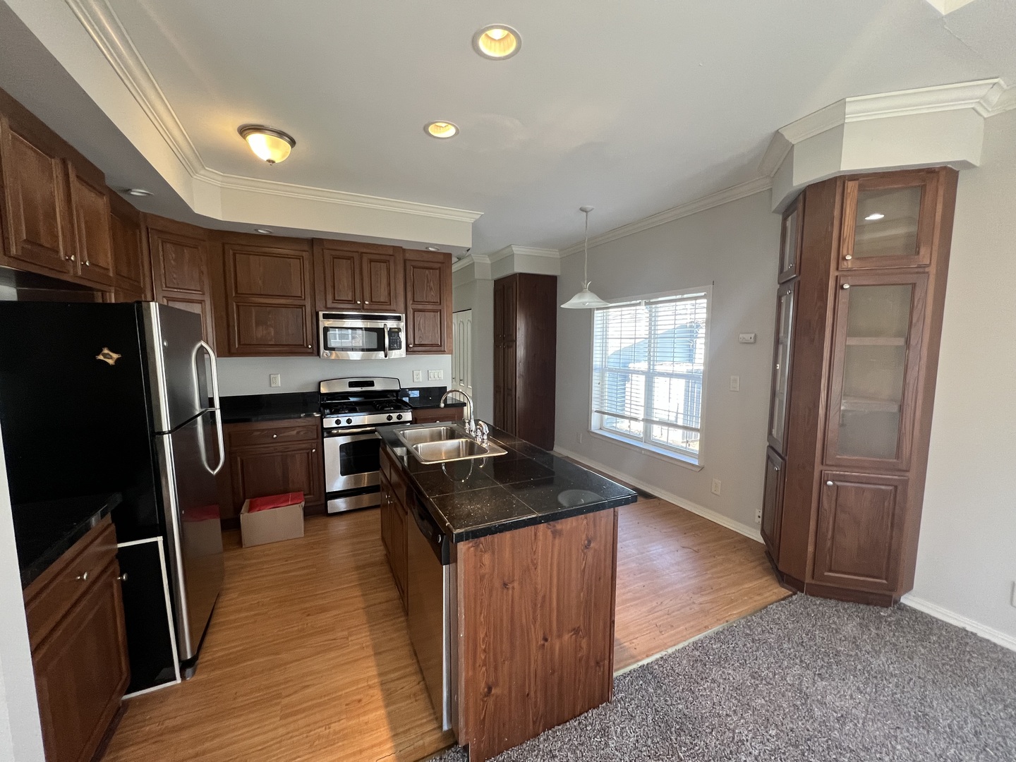 230 Northshore Road Elgin, IL 60123 - Photo 7 of 16 a kitchen with granite countertop stainless steel appliances a refrigerator stove top oven and sink