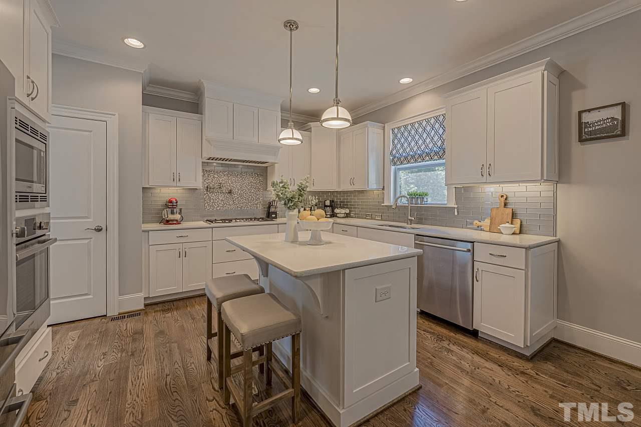 7605 Stonehenge Farm Lane Raleigh, NC 27613 - Photo 3 of 30 Warm and inviting kitchen