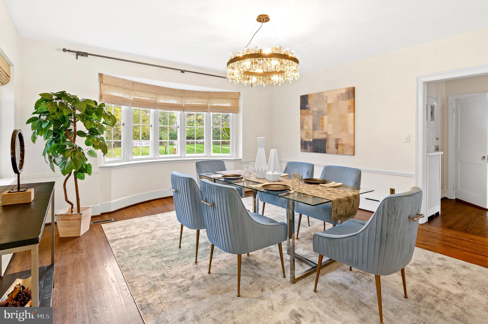 7704 Crossland Road Pikesville, MD 21208 - Photo 15 of 68 a view of a dining room with furniture window and wooden floor