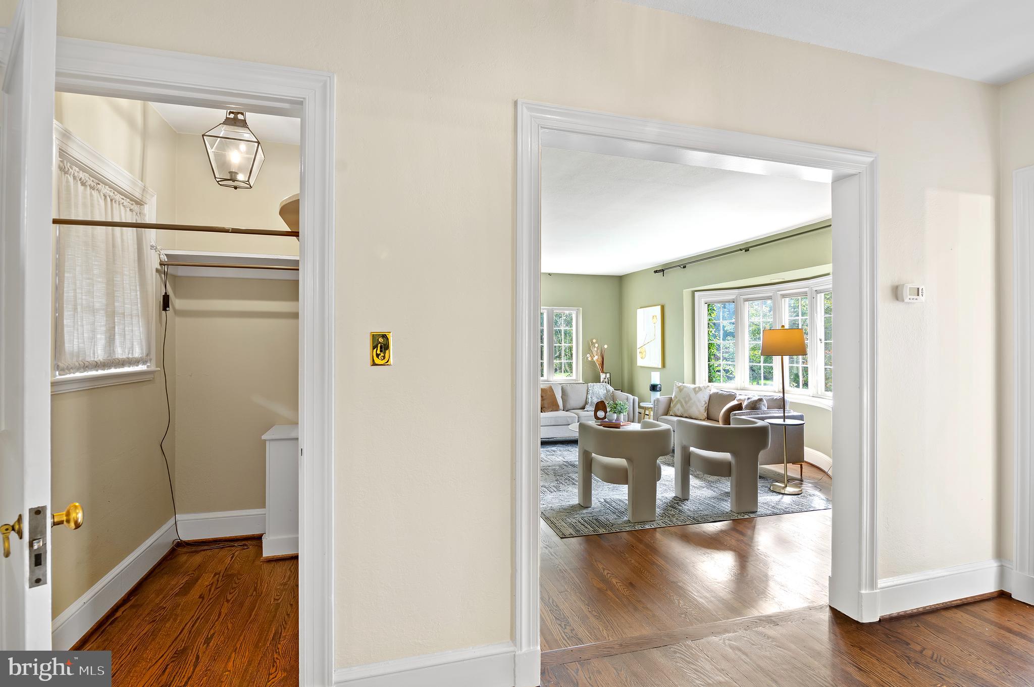 7704 Crossland Road Pikesville, MD 21208 - Photo 22 of 68 a view of a dining room with furniture wooden floor and a chandelier