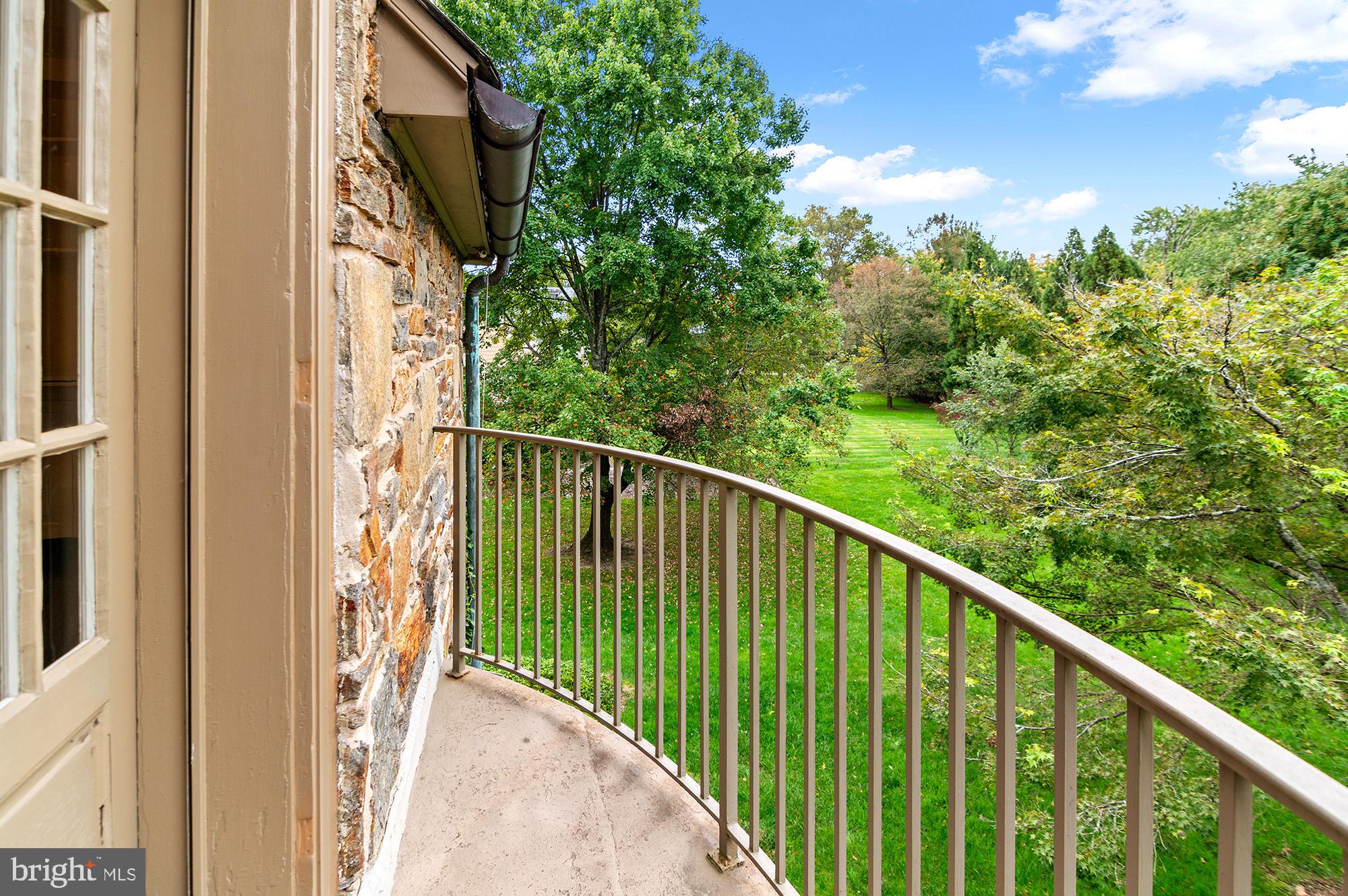 7704 Crossland Road Pikesville, MD 21208 - Photo 30 of 68 a view of a balcony with an outdoor space