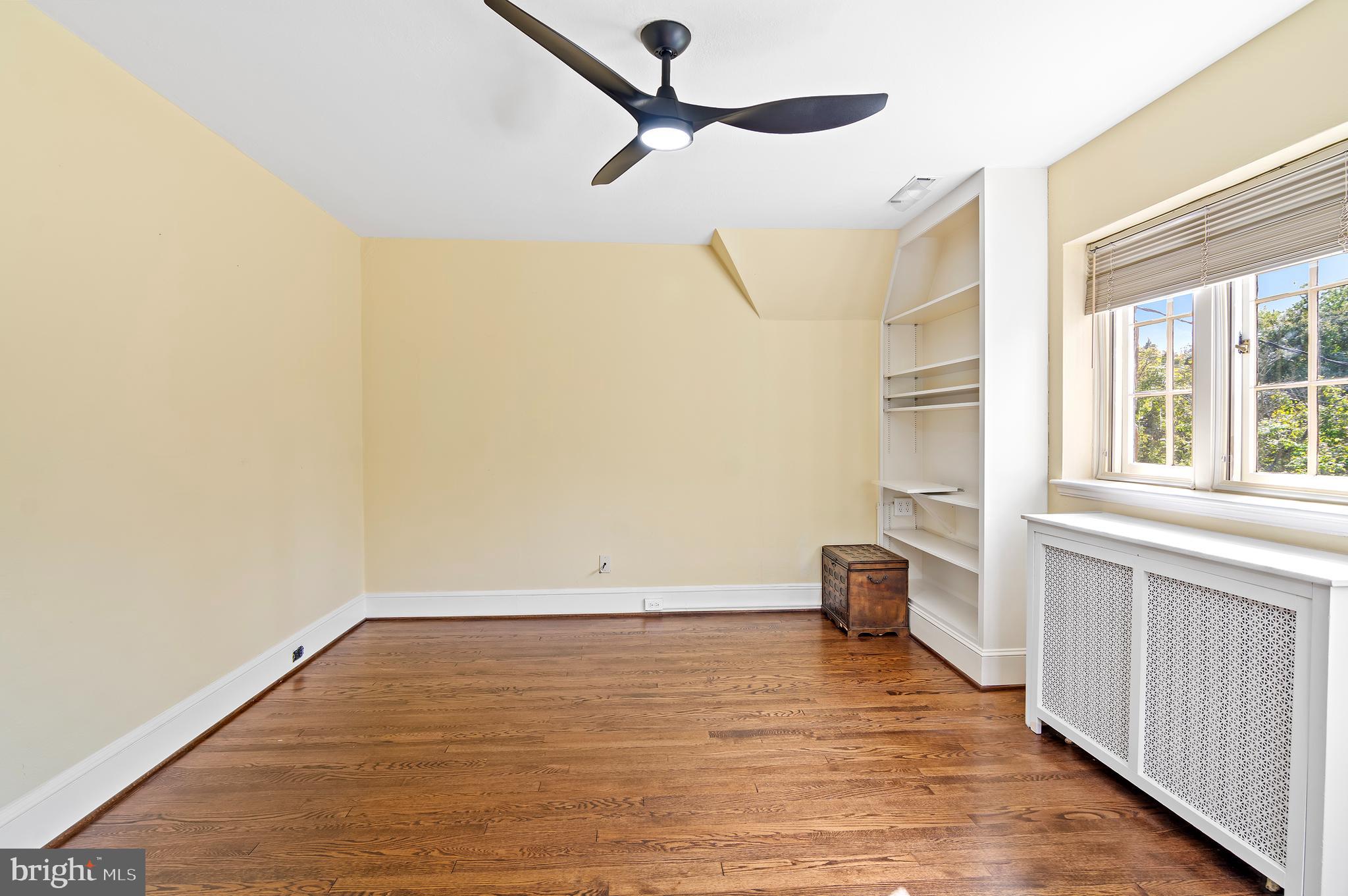 7704 Crossland Road Pikesville, MD 21208 - Photo 35 of 68 a view of empty room with wooden floor