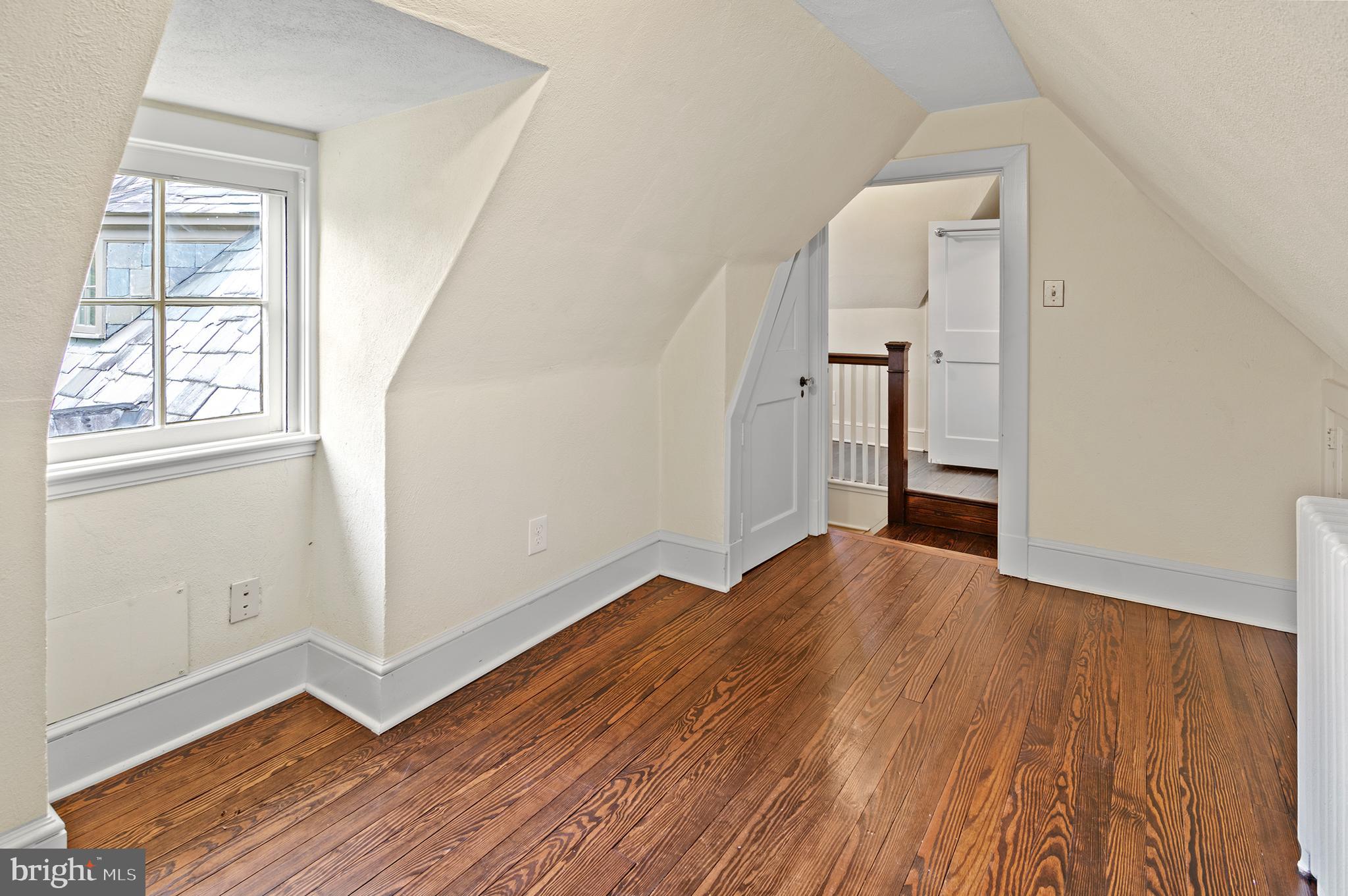 7704 Crossland Road Pikesville, MD 21208 - Photo 44 of 68 wooden floor in an empty room with a window