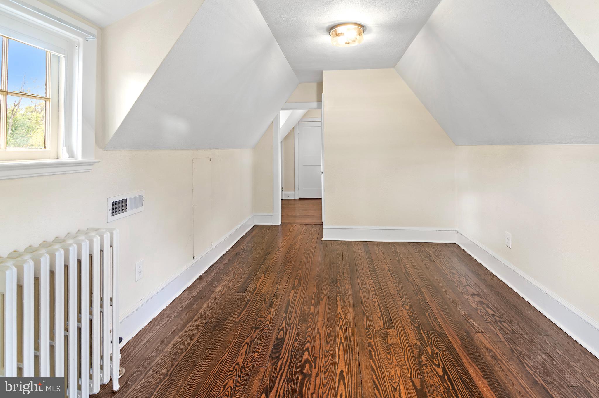 7704 Crossland Road Pikesville, MD 21208 - Photo 48 of 68 a view of a hallway with wooden floor
