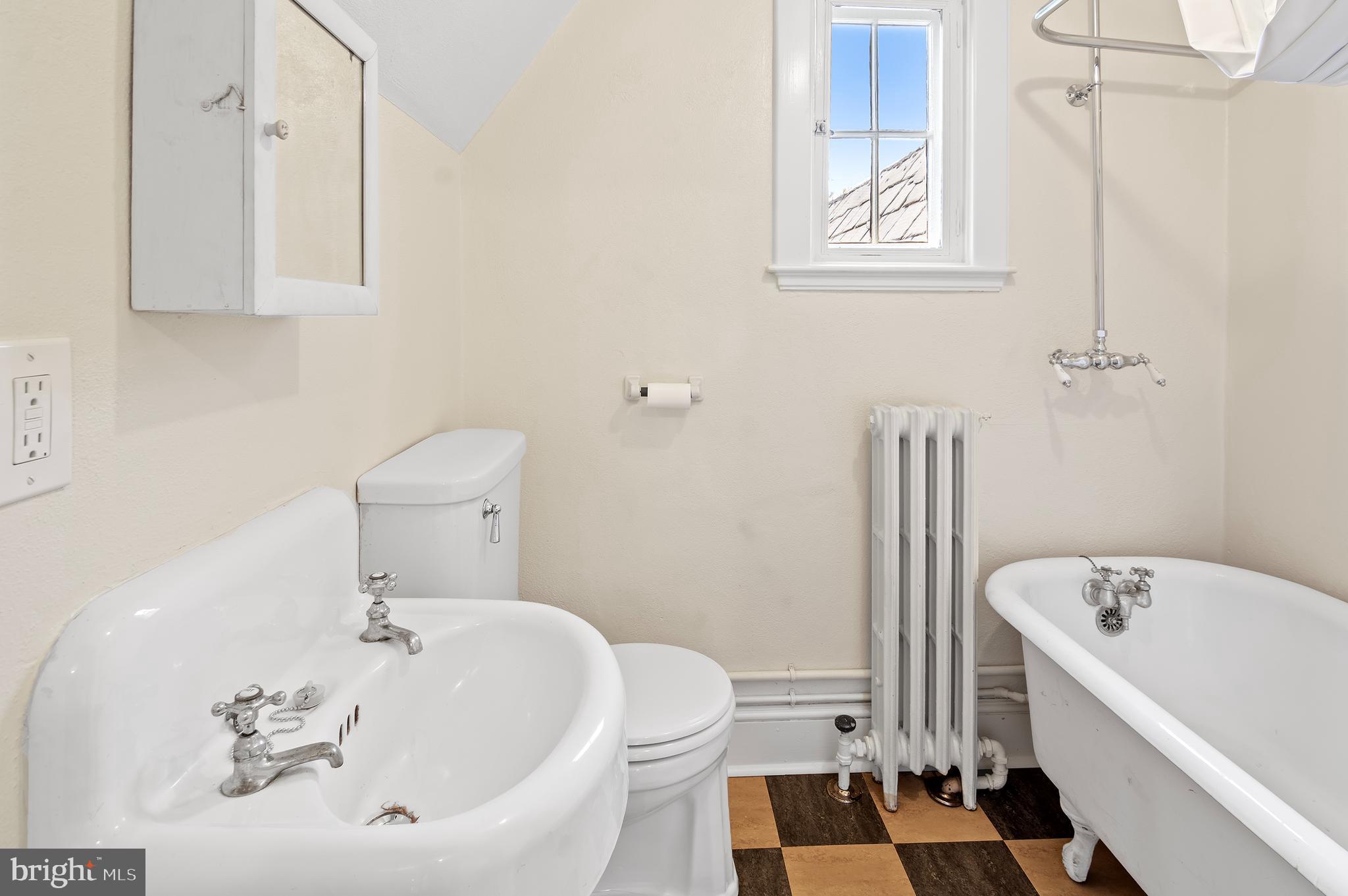 7704 Crossland Road Pikesville, MD 21208 - Photo 49 of 68 a bathroom with a sink and bathtub with toilet