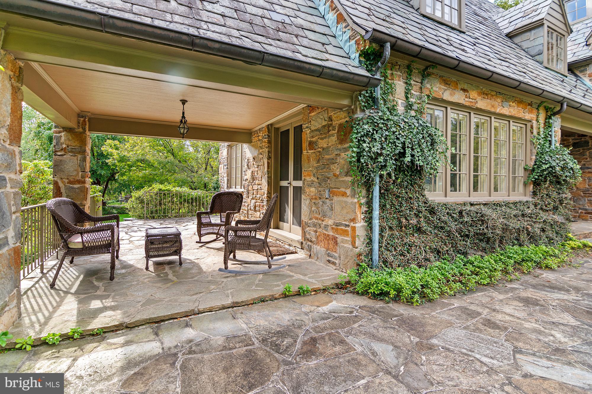 7704 Crossland Road Pikesville, MD 21208 - Photo 53 of 68 a view of a patio with table and chairs and potted plants