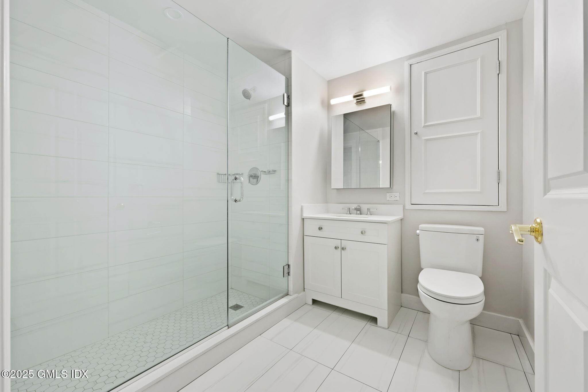 2 East Elm Street, Unit 35 Greenwich, CT 06830 - Photo 15 of 26 a bathroom with a toilet and a sink