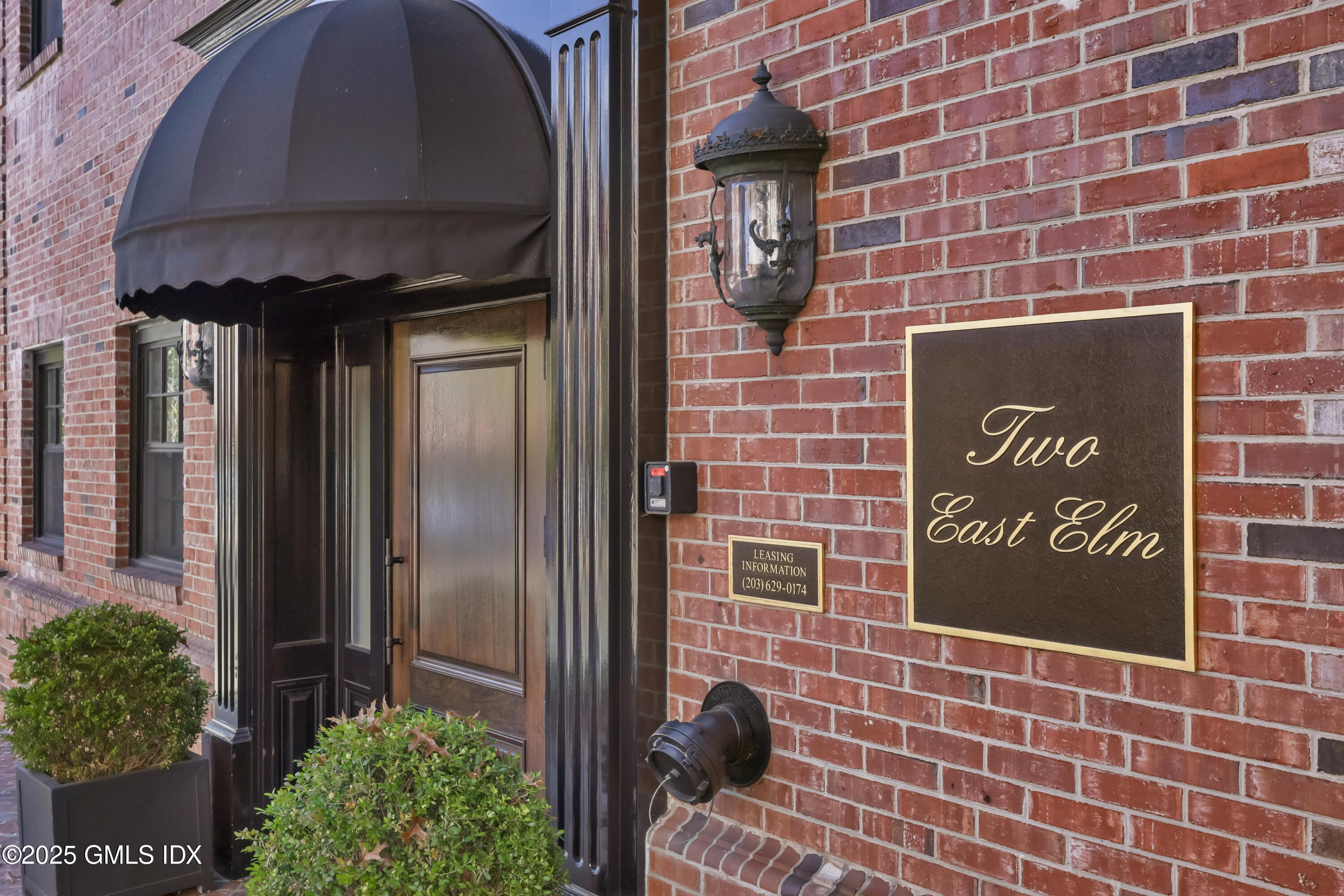 2 East Elm Street, Unit 35 Greenwich, CT 06830 - Photo 2 of 21 a brick building with a sign on it