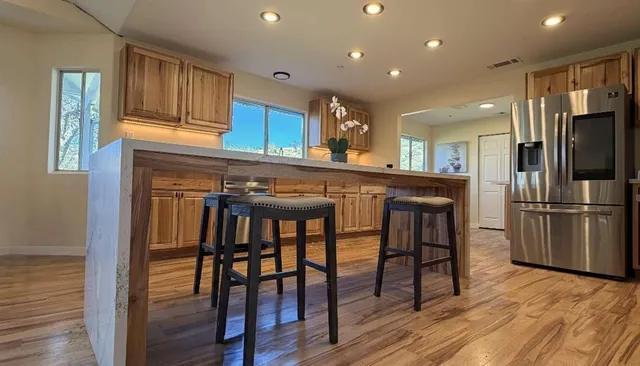 a view of a garden with lawn chairs
