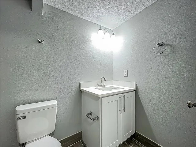 a bathroom with a toilet and bathtub